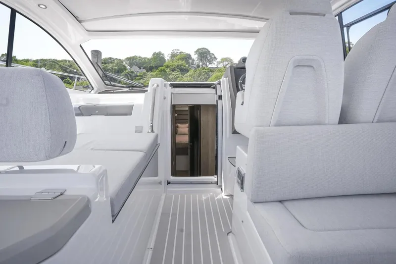 Slide: The Image of Interior of 2026 Azimut Atlantis 45 yacht, featuring sleek white seating and modern design. - 26