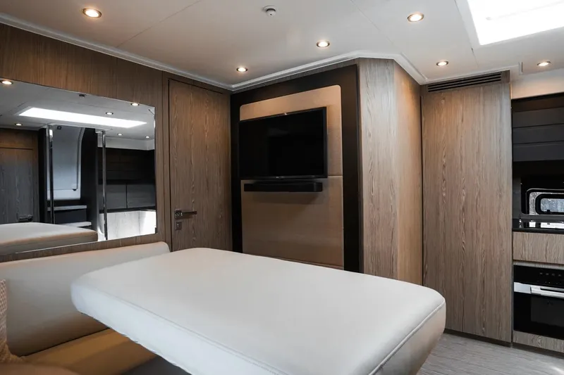 Slide: The Image of Luxurious interior of 2026 Azimut Atlantis 45 yacht with modern wood finishes and sleek design. - 30