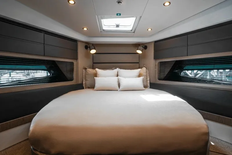 Slide: The Image of Luxurious bedroom interior of 2026 Azimut Atlantis 45 yacht, featuring modern design and ambient lighting. - 31