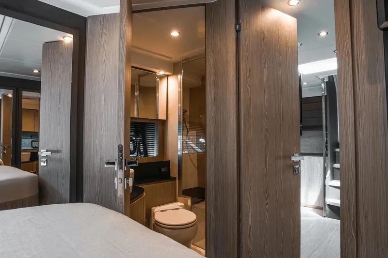 Slide: The Image of Luxurious interior of 2026 Azimut Atlantis 45 yacht, featuring modern bathroom and wooden finishes. - 32