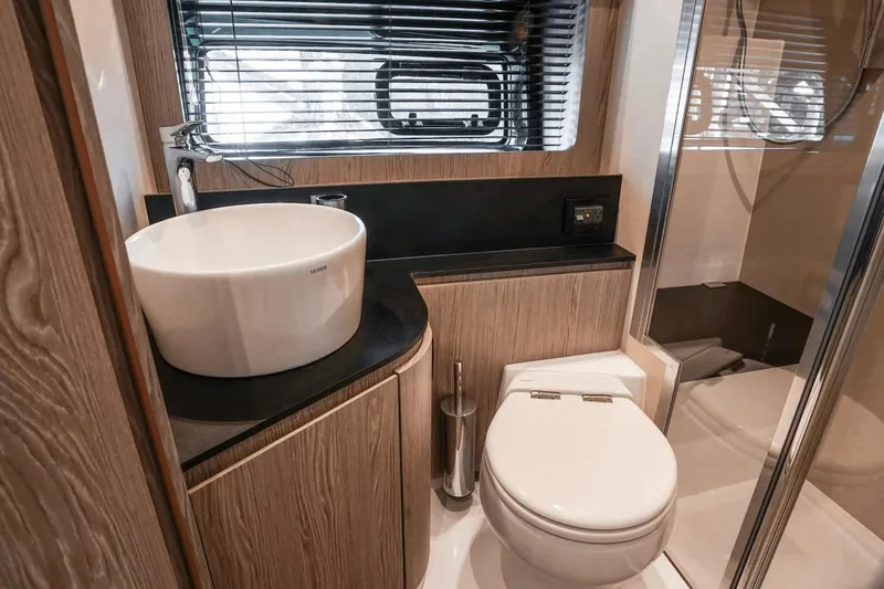 Slide: The Image of Luxurious bathroom in 2026 Azimut Atlantis 45 yacht with modern fixtures and elegant design. - 33
