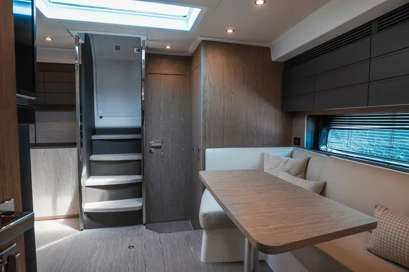 Slide: The Image of Luxurious interior of 2026 Azimut Atlantis 45 yacht with modern dining area and staircase. - 35