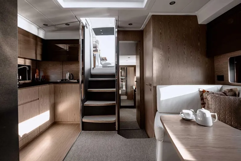 Slide: The Image of 2026 Azimut Atlantis 45 yacht cruising on calm waters under clear skies. - 4