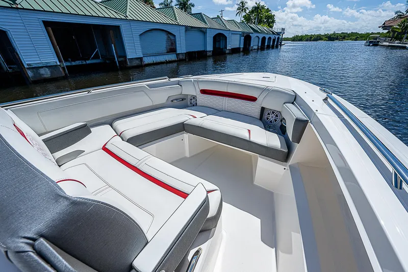 Slide: The Image of 2021 Tiara Yachts 34 LS boat interior with luxurious seating on a sunny day. - 16