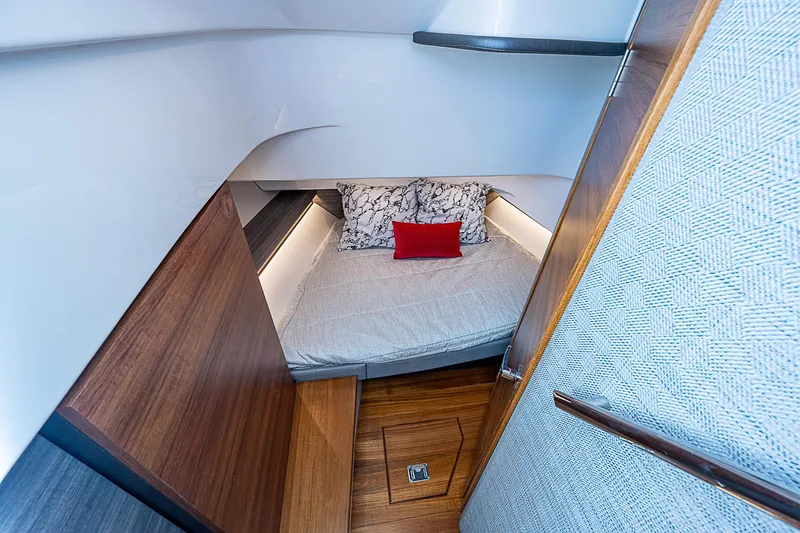 Slide: The Image of 2021 Tiara Yachts 34 LS cabin interior with cozy bed and modern design. - 19