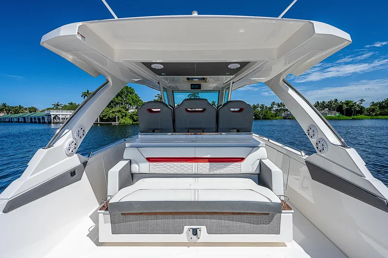 Slide: The Image of 2021 Tiara Yachts 34 LS luxury boat interior with seating, on a sunny day. - 31