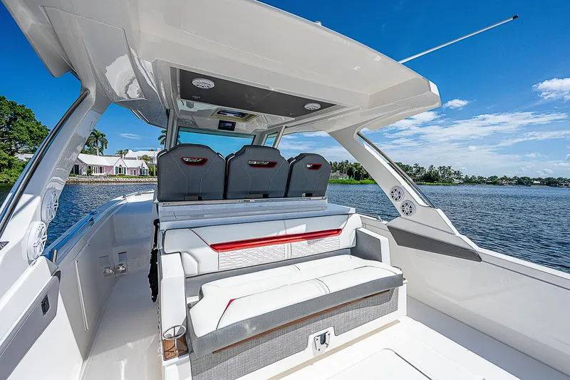 Slide: The Image of 2021 Tiara Yachts 34 LS luxury boat interior with seating, on a sunny day. - 32