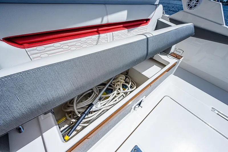 Slide: The Image of Storage compartment on 2021 Tiara Yachts 34 LS, featuring ropes and equipment. - 33