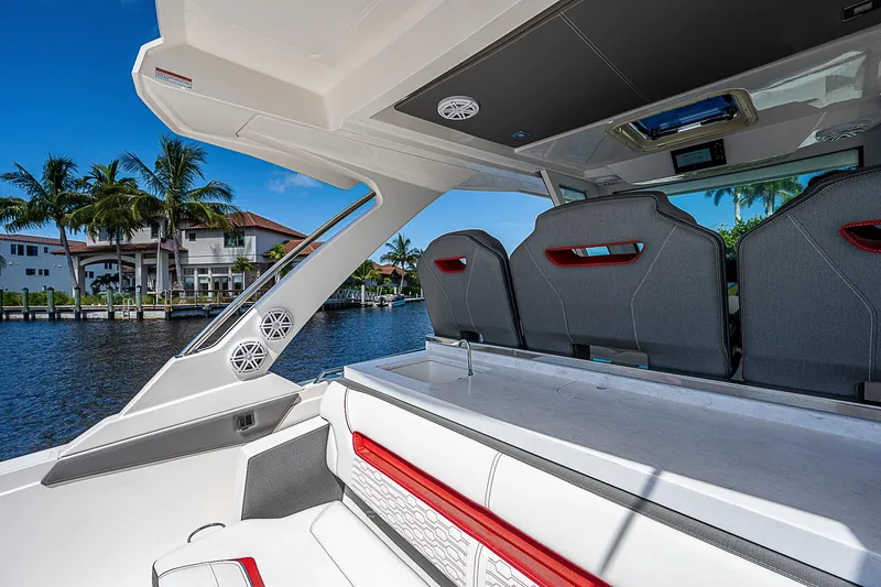 Slide: The Image of 2021 Tiara Yachts 34 LS interior with waterfront view and palm trees. - 36