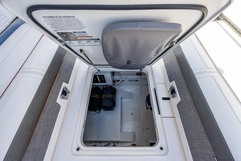 Slide: The Image of Open hatch of 2021 Tiara Yachts 34 LS, revealing interior storage compartment. - 37