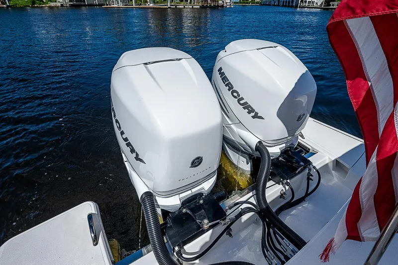 Slide: The Image of 2021 Tiara Yachts 34 LS with dual Mercury outboard engines on a lake. - 40
