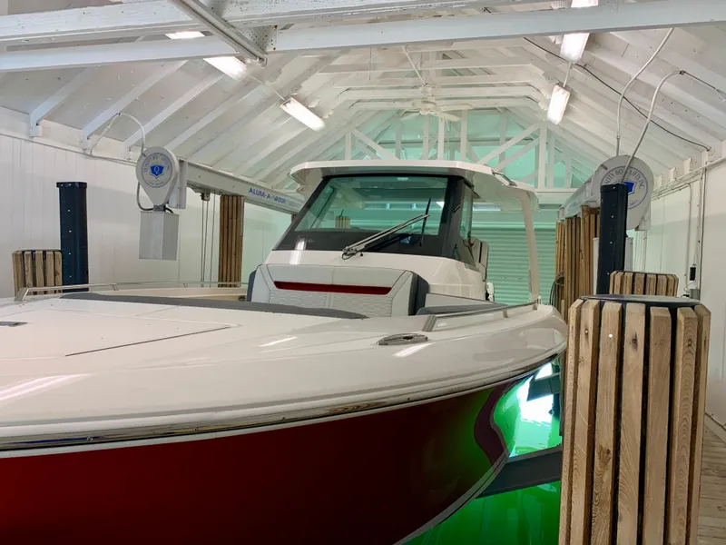 Slide: The Image of 2021 Tiara Yachts 34 LS in a boathouse, showcasing sleek design and modern features. - 42