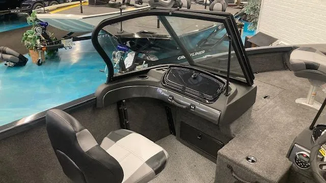 Slide: The Image of 2025 Crestliner 1650 Hawk boat interior with seating and dashboard. - 5