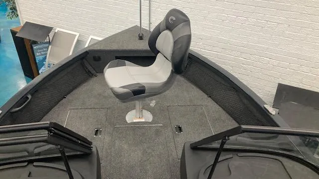 Slide: The Image of 2025 Crestliner 1650 Hawk boat interior with swivel seat and carpeted deck. - 7