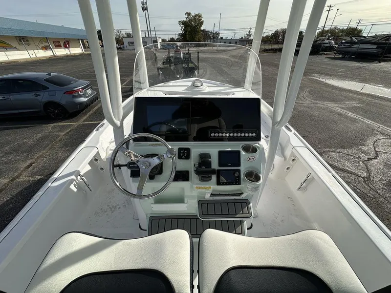 Slide: The Image of 2025 Tidewater 2210 Cb boat interior with modern dashboard and steering wheel. - 18