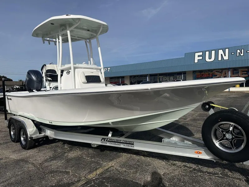 Slide: The Image of 2025 Tidewater 2210 Cb boat on trailer in dealership lot. - 3