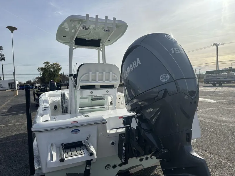 Slide: The Image of 2025 Tidewater 2210 Cb boat with Yamaha 150 engine in a parking lot. - 6