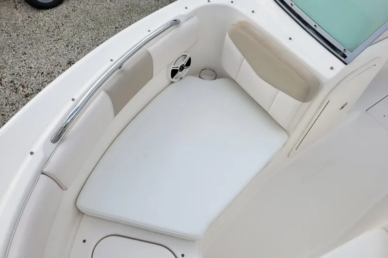 Slide: The Image of 2017 Robalo R227 Dual Console boat interior with cushioned seating. - 15