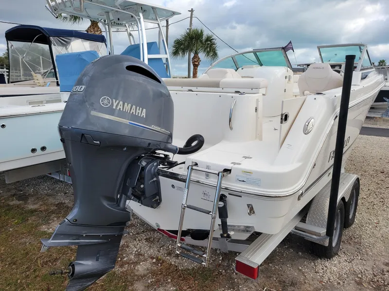 Slide: The Image of 2017 Robalo R227 Dual Console boat with Yamaha outboard motor on trailer. - 2