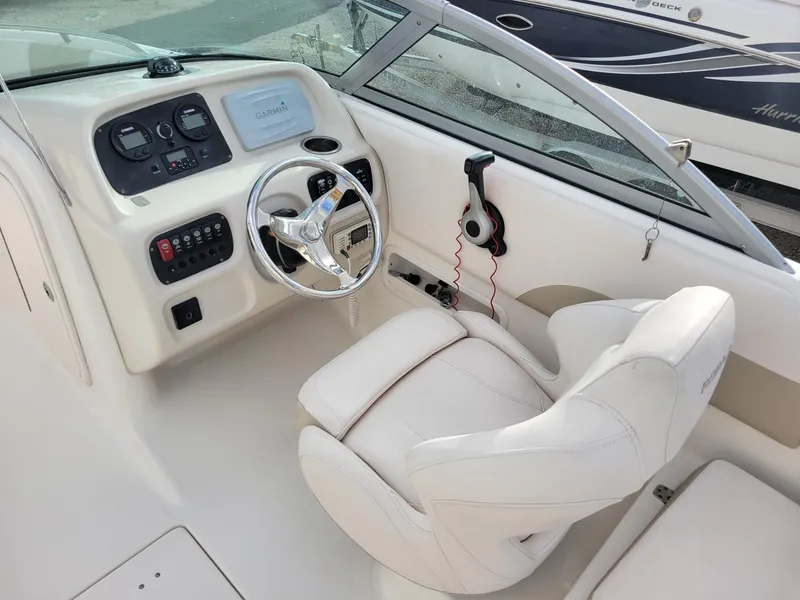 Slide: The Image of 2017 Robalo R227 Dual Console boat interior with steering wheel and dashboard controls. - 9