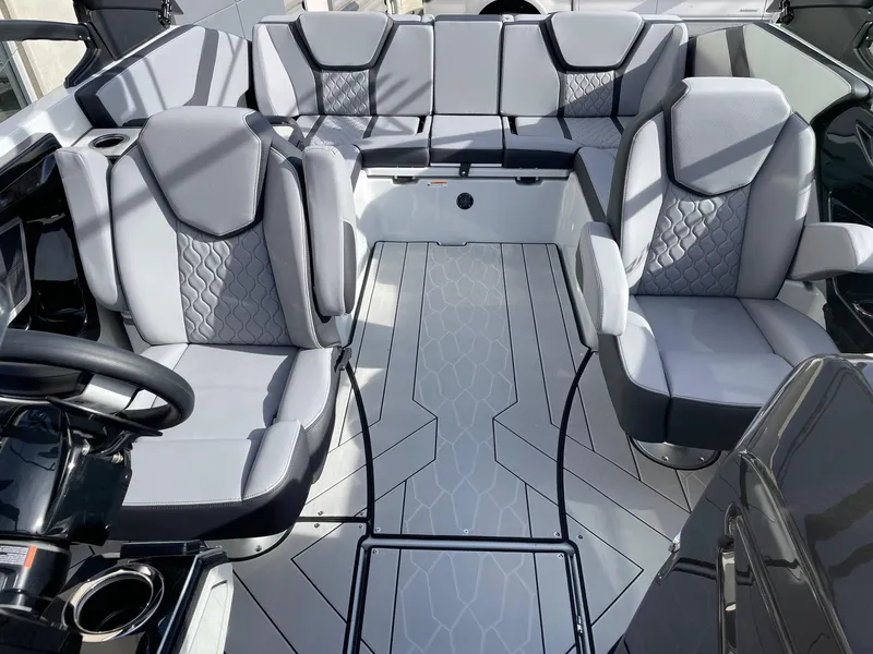 Slide: The Image of 2025 Yamaha Boats 255XD interior with modern gray seating and sleek design. - 12