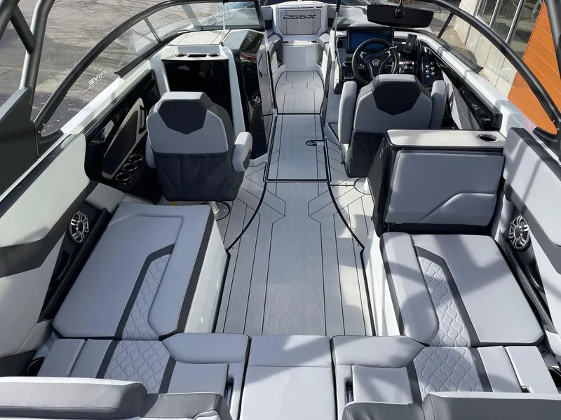 Slide: The Image of 2025 Yamaha Boats 255XD interior, featuring sleek seating and modern design. - 5