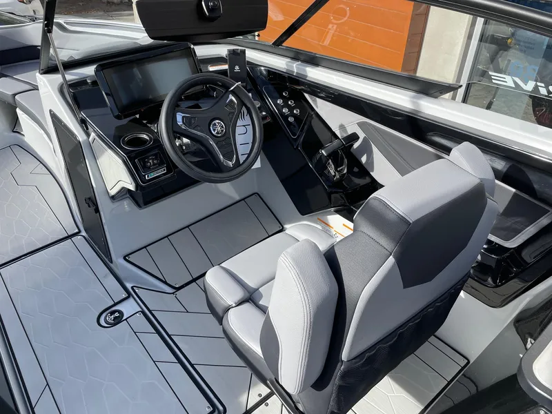 Slide: The Image of 2025 Yamaha Boats 255XD interior with modern dashboard and seating. - 6