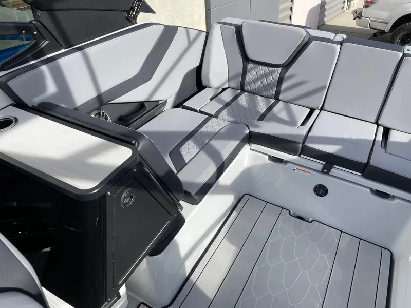 Slide: The Image of 2025 Yamaha Boats 255XD interior with sleek gray seating and modern design. - 7