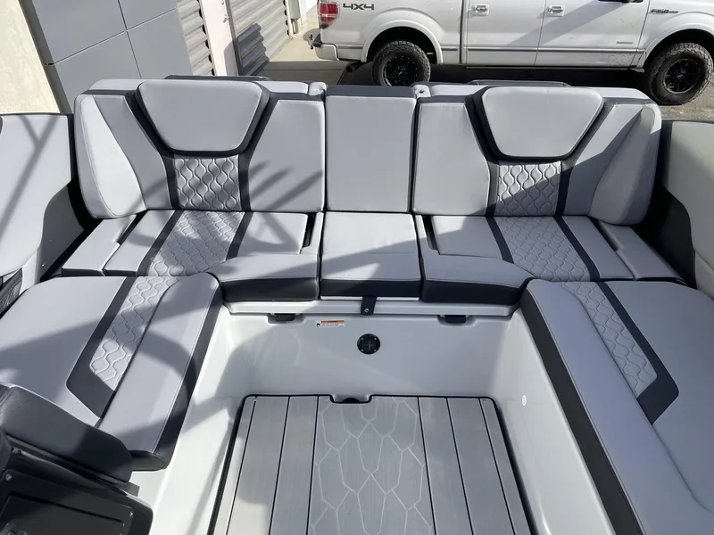 Slide: The Image of 2025 Yamaha Boats 255XD interior seating with modern design and gray upholstery. - 8