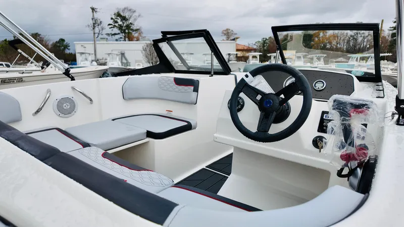Slide: The Image of 2025 Bayliner M17 boat interior with modern steering and seating. - 7