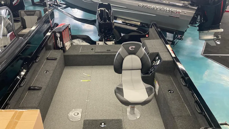 Slide: The Image of 2025 Crestliner 1650 Pro Tiller boat interior with single seat and spacious deck. - 2