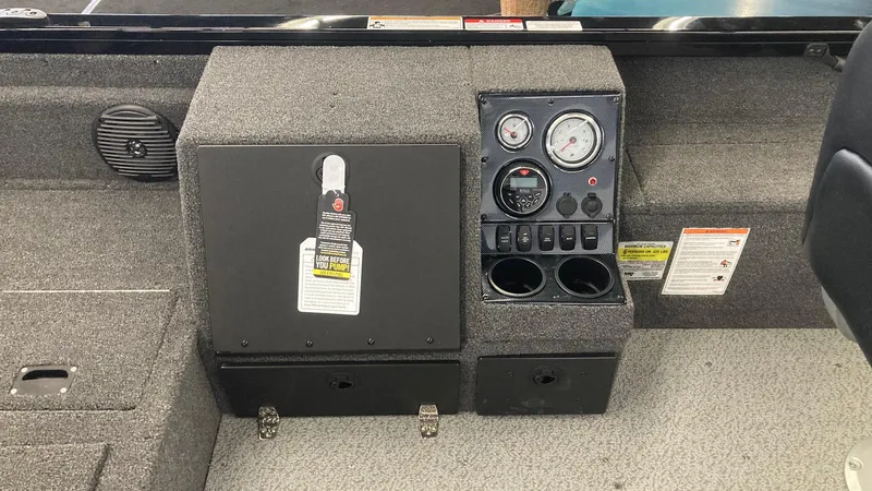 Slide: The Image of 2025 Crestliner 1650 Pro Tiller dashboard with gauges and controls. - 4