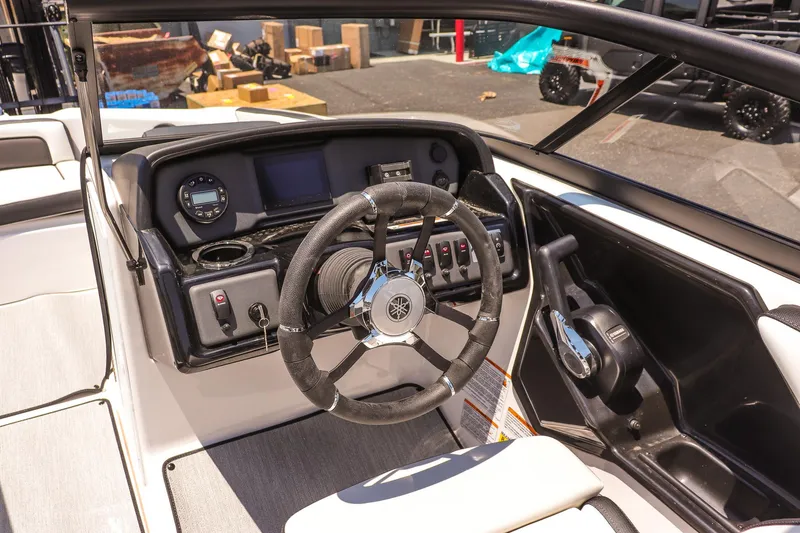 Slide: The Image of 2025 Yamaha Boats AR195 dashboard with steering wheel and controls. - 9