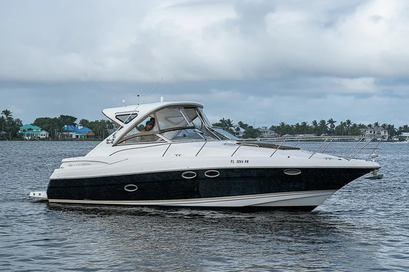 The Image of 2008 Regal Commodore 3760 IB yacht cruising on a calm lake. - 0