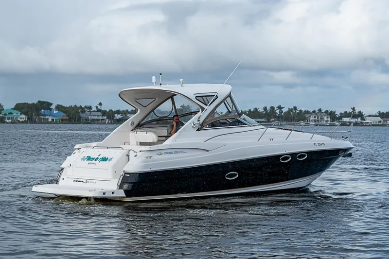 Slide: The Image of 2008 Regal Commodore 3760 IB cruising on a calm lake. - 10