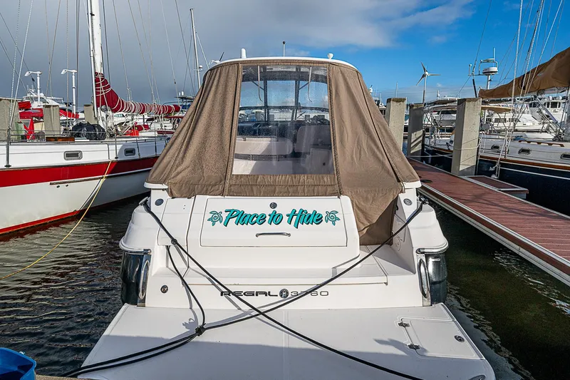 Slide: The Image of 2008 Regal Commodore 3760 IB boat docked at marina, rear view with canopy. - 13