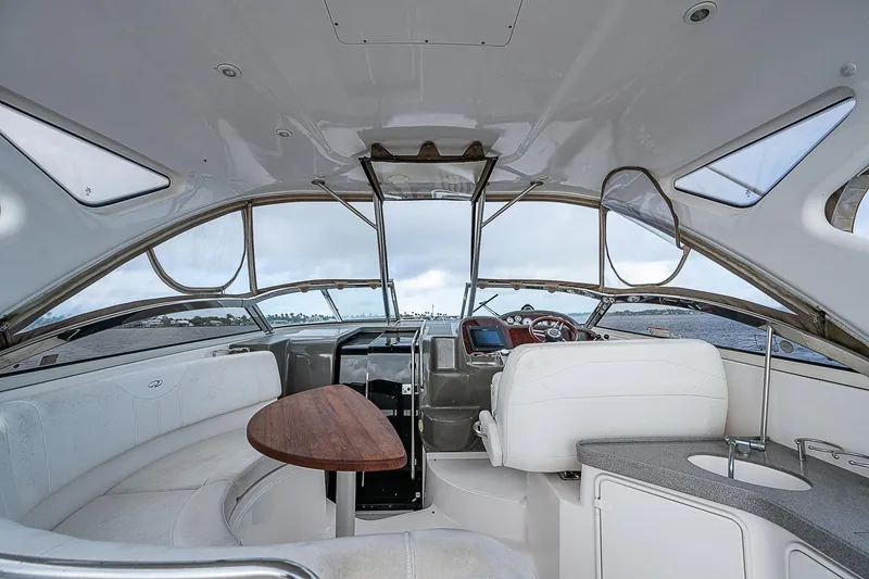 Slide: The Image of Interior of 2008 Regal Commodore 3760 IB yacht with seating and helm. - 16