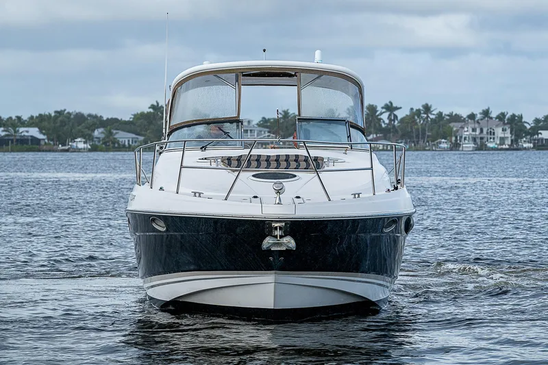 Slide: The Image of 2008 Regal Commodore 3760 IB yacht on calm water, front view. - 2