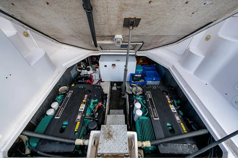 Slide: The Image of Engine compartment of 2008 Regal Commodore 3760 IB boat, showcasing dual engines. - 27