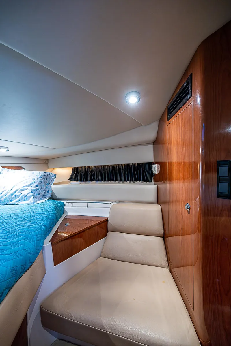 Slide: The Image of Interior of 2008 Regal Commodore 3760 IB yacht with cozy seating and bed. - 31