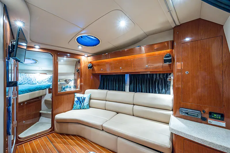 Slide: The Image of Luxurious interior of 2008 Regal Commodore 3760 IB yacht with plush seating and wood finishes. - 35
