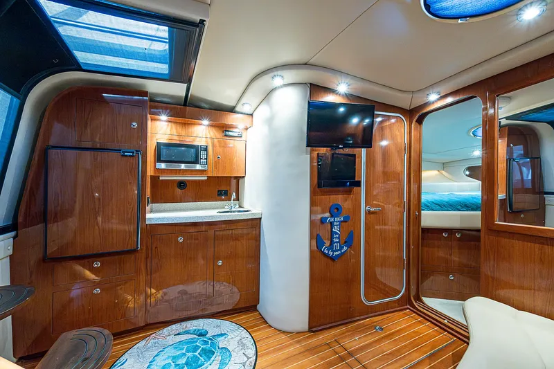Slide: The Image of Luxurious 2008 Regal Commodore 3760 IB yacht interior with wood finish and modern amenities. - 36