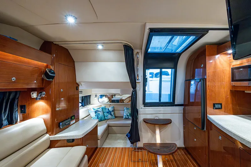 Slide: The Image of Luxurious interior of 2008 Regal Commodore 3760 IB yacht with wood finishes and seating. - 42