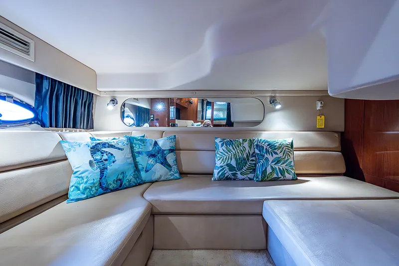 Slide: The Image of Luxurious interior of 2008 Regal Commodore 3760 IB yacht with plush seating and decorative pillows. - 48