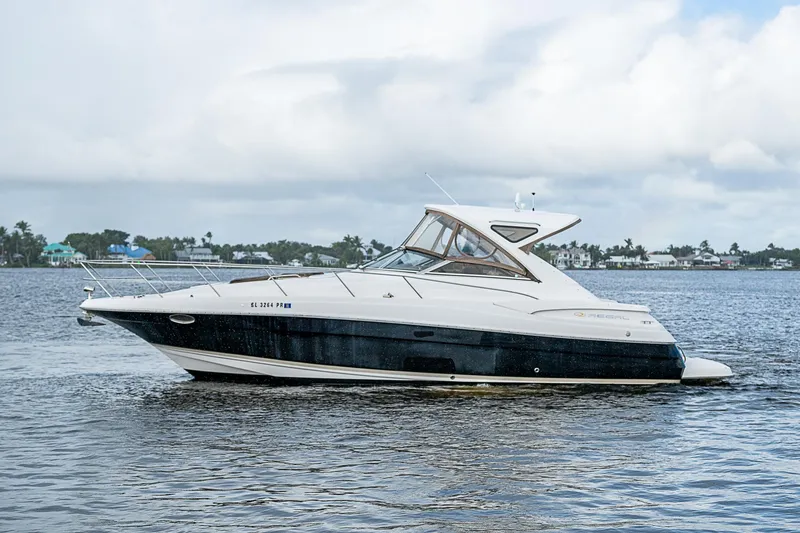 Slide: The Image of 2008 Regal Commodore 3760 IB yacht on calm water, side view. - 5