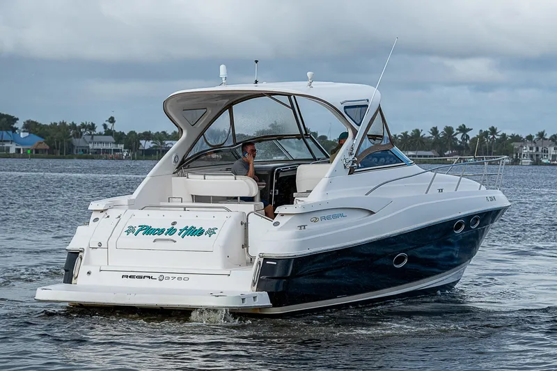Slide: The Image of 2008 Regal Commodore 3760 IB cruising on a calm lake. - 9