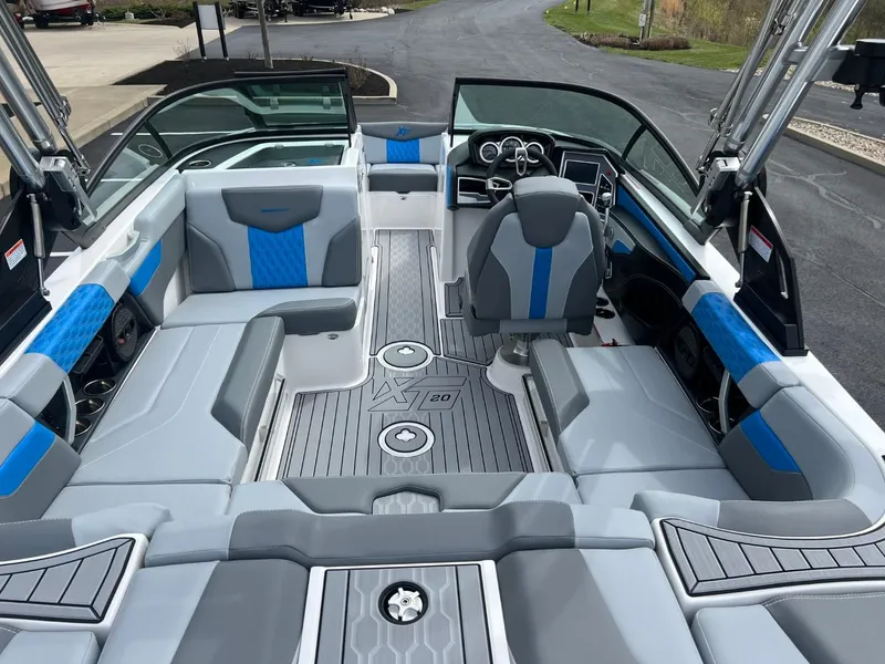 Slide: The Image of 2024 MasterCraft XT20 boat interior with modern seating and sleek design. - 12