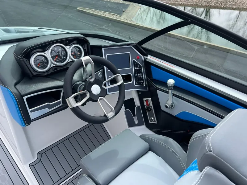 Slide: The Image of 2024 MasterCraft XT20 boat dashboard with modern controls and sleek design. - 9