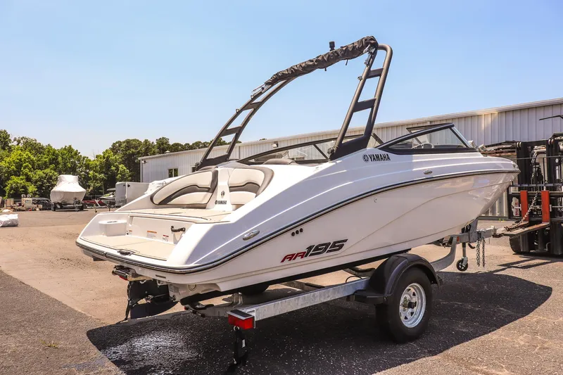 Slide: The Image of 2025 Yamaha Boats AR195 on trailer, sleek design, outdoor setting. - 4