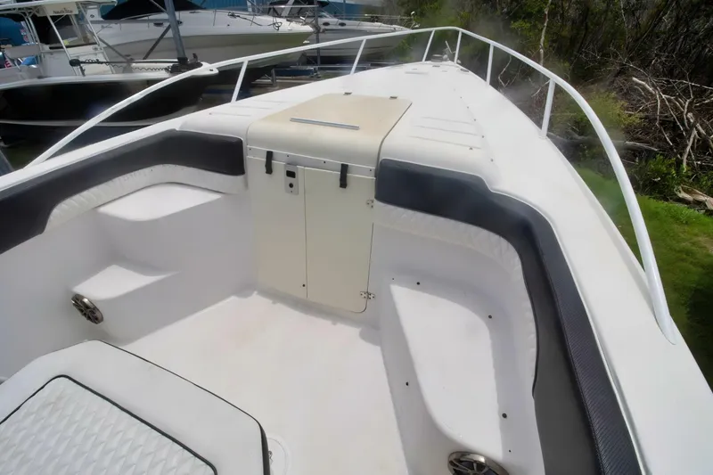 Slide: The Image of 2005 Donzi 35 ZF Cuddy boat interior with seating and storage compartments. - 13